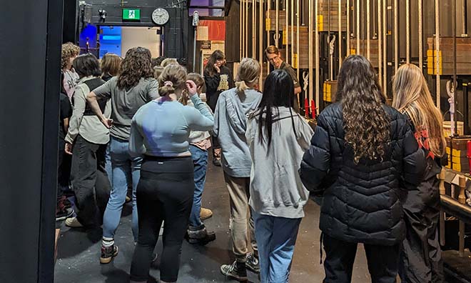  School group touring backstage. 